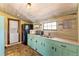 Charming kitchen featuring a washer and dryer, granite countertops and modern appliances at 527 Main St, Suwanee, GA 30024