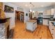 Spacious kitchen with an island, stainless steel appliances, and access to a dining area at 527 Main St, Suwanee, GA 30024