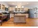 Charming kitchen featuring an island, updated appliances, and ample counter space at 527 Main St, Suwanee, GA 30024