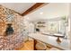 Well-lit kitchen featuring updated appliances, marble counters, and vintage-style decor at 527 Main St, Suwanee, GA 30024