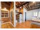 Laundry room with a folding table, shelves, and wood accents, featuring a washer and dryer at 527 Main St, Suwanee, GA 30024
