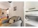 Cozy living room and sleeping nook with gray armchair and bunkbeds at 527 Main St, Suwanee, GA 30024