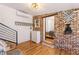 Open living space boasts hardwood floors, shiplap walls, and modern staircase to second floor at 527 Main St, Suwanee, GA 30024
