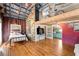Open-concept living room with unique architectural details and colorful accents at 527 Main St, Suwanee, GA 30024