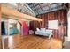 Unique open living room design with high ceilings and exposed beams at 527 Main St, Suwanee, GA 30024