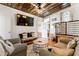 Relaxing living room features stylish decor, tin ceilings, hardwood floors, and natural light at 527 Main St, Suwanee, GA 30024