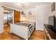 Comfortable main bedroom with barn door entrance, shiplap walls, and stylish decor at 527 Main St, Suwanee, GA 30024