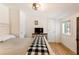 Cozy main bedroom features shiplap walls, wood floors, and rustic-style furnishings at 527 Main St, Suwanee, GA 30024
