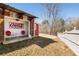 Exterior patio with Coca-Cola decor, seating area, and partial fencing at 527 Main St, Suwanee, GA 30024