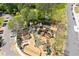 Aerial view of community playground with multiple play structures and a surrounding walking path at 527 Main St, Suwanee, GA 30024