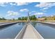 Modern water feature with a reflective pool in a park-like setting, surrounded by trees and green spaces at 527 Main St, Suwanee, GA 30024