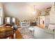 Charming sitting room featuring vintage furnishings and a vaulted ceiling at 527 Main St, Suwanee, GA 30024