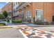 Street view of a commercial building with retail storefronts and pedestrian crosswalks at 527 Main St, Suwanee, GA 30024