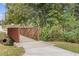 Charming walking bridge along the path, surrounded by trees and greenery at 527 Main St, Suwanee, GA 30024