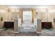 Bright bathroom featuring dual vanities, a soaking tub, and a window providing natural light at 7328 Vigo Dr, Lithonia, GA 30058