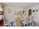 Formal dining room with elegant chairs, chandelier, and sophisticated decor at 7328 Vigo Dr, Lithonia, GA 30058