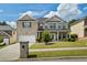 Beautiful two-story brick home featuring a manicured front yard and inviting entrance at 7328 Vigo Dr, Lithonia, GA 30058