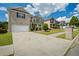 Traditional brick house with a two-car garage and well-maintained landscaping on a sunny day at 7328 Vigo Dr, Lithonia, GA 30058