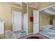 Hallway leading to the main bedroom and bathroom has marble-patterned vinyl flooring at 7328 Vigo Dr, Lithonia, GA 30058