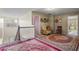 Open landing with neutral walls, a staircase, a sitting area, and access to other rooms at 7328 Vigo Dr, Lithonia, GA 30058