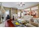 Spacious living room with a fireplace, decorative furniture, hardwood floors, and great natural light at 7328 Vigo Dr, Lithonia, GA 30058