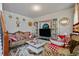 Cozy living room featuring comfortable seating, built-in shelving, and stylish decor at 7328 Vigo Dr, Lithonia, GA 30058