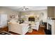 Ornate living room with modern furniture, a fireplace, and access to a work area with a black office chair at 7328 Vigo Dr, Lithonia, GA 30058