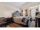 A spacious main bedroom features luxurious furnishings including a large ornate headboard and soft lighting at 7328 Vigo Dr, Lithonia, GA 30058