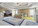 Bright and airy main bedroom featuring a tray ceiling, luxury bed and decorative rugs on neutral carpet at 7328 Vigo Dr, Lithonia, GA 30058