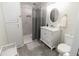 Bright bathroom with white marble shower, modern fixtures, and stylish tile flooring for a luxurious feel at 8315 Nicholson Rd, Cumming, GA 30028