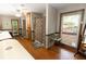 Unique bathroom featuring hardwood floors, garden views, and individual shower stalls for privacy and convenience at 8315 Nicholson Rd, Cumming, GA 30028
