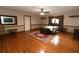 Spacious bedroom featuring wood floors, area rug, ample lighting, and decorative accents at 8315 Nicholson Rd, Cumming, GA 30028