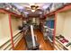 Walk-in closet with organized shelving, a treadmill and storage bins at 8315 Nicholson Rd, Cumming, GA 30028