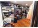 Walk-in closet with clothes, shelves and storage bins at 8315 Nicholson Rd, Cumming, GA 30028