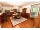 Dining room featuring hardwood floors, elegant furniture, and natural light at 8315 Nicholson Rd, Cumming, GA 30028