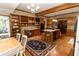 Spacious open-concept kitchen with wood cabinets and adjacent breakfast nook at 8315 Nicholson Rd, Cumming, GA 30028