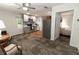 Combined living space with kitchenette and bedroom, offering stainless steel appliances and abundant natural light at 8315 Nicholson Rd, Cumming, GA 30028