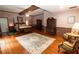Main bedroom with hardwood flooring, furniture and a decorative rug at 8315 Nicholson Rd, Cumming, GA 30028