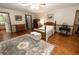 Spacious main bedroom with hardwood floors, a ceiling fan, and ample natural light at 8315 Nicholson Rd, Cumming, GA 30028