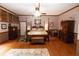 Main bedroom featuring hardwood floors, wood beam ceiling, and neutral color scheme at 8315 Nicholson Rd, Cumming, GA 30028