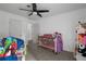 Bedroom featuring a ceiling fan, comfortable carpet, and neutral wall paint at 105 Olde Mill Ln, Norcross, GA 30093