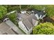 An aerial view highlights the property's layout, including a backyard with a patio, detached garage, and landscaping at 1201 Beech Valley Ne Rd, Atlanta, GA 30306