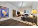 Open-concept basement with dark hardwood floors, large sectional sofa, and TV at 1201 Beech Valley Ne Rd, Atlanta, GA 30306