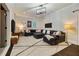 Spacious basement living area with an oversized sectional sofa, TV and decorative area rug at 1201 Beech Valley Ne Rd, Atlanta, GA 30306