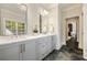 Bathroom featuring double vanity, marble countertop, modern fixtures, and doorway view at 1201 Beech Valley Ne Rd, Atlanta, GA 30306