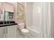 Well-lit bathroom featuring a white subway tile shower and black granite countertop at 1201 Beech Valley Ne Rd, Atlanta, GA 30306