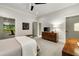 Bright bedroom with ensuite golf simulator, TV, and dark wood furniture at 1201 Beech Valley Ne Rd, Atlanta, GA 30306