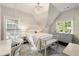 Charming bedroom featuring a whimsical hanging chair, crystal chandelier and ensuite bathroom access at 1201 Beech Valley Ne Rd, Atlanta, GA 30306