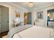 Bedroom featuring neutral decor, desk and an adjacent bathroom at 1201 Beech Valley Ne Rd, Atlanta, GA 30306
