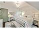 Bright bedroom with chandelier, woven headboard, accent bench and swing chair at 1201 Beech Valley Ne Rd, Atlanta, GA 30306